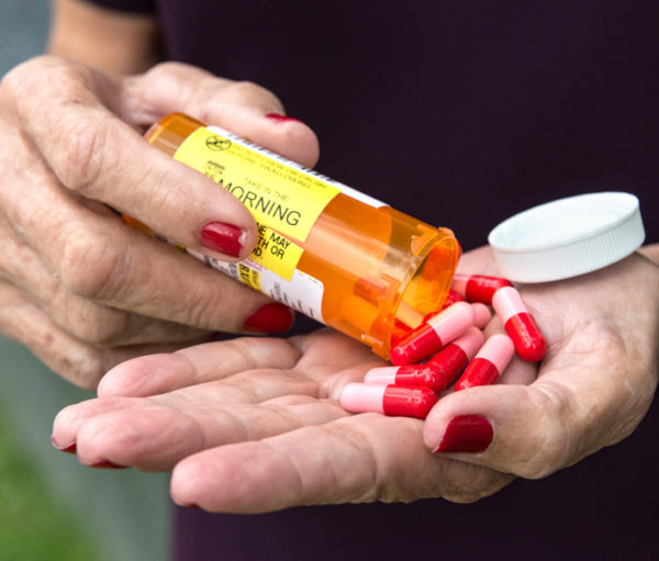 Closeup of hand with pills